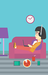 Image showing Woman lying on sofa with many gadgets.