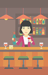 Image showing Bartender standing at the bar counter.