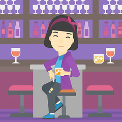 Image showing Woman sitting at the bar counter.