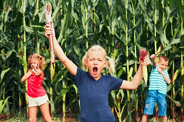 Image showing Mischievous girls and boy