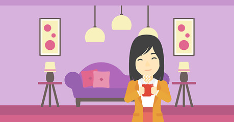 Image showing Woman enjoying cup of hot coffee.