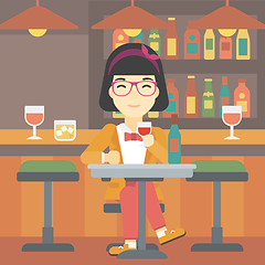 Image showing Woman drinking wine at restaurant.