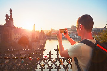 Image showing Traveler taking photo by mobile phone