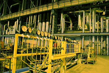 Image showing Pipes, tubes, machinery and steam turbine at a power plant