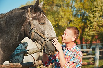 Image showing Man with horse