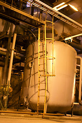 Image showing Pipes and tubes and chimney at a power plant