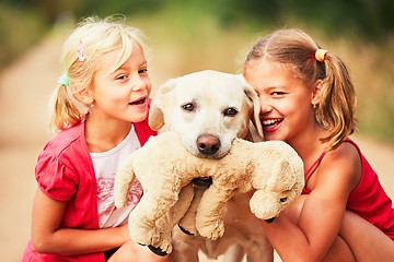 Image showing Sisters with dog. 