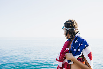 Image showing Back view of wet-haired woman in american flag