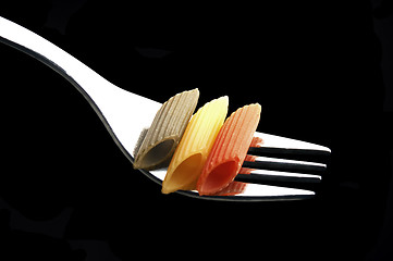 Image showing italian penne pasta on a fork
