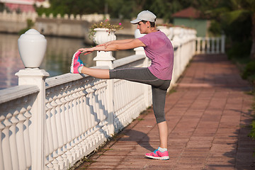 Image showing woman  stretching before morning jogging