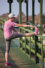 Image showing woman  stretching before morning jogging