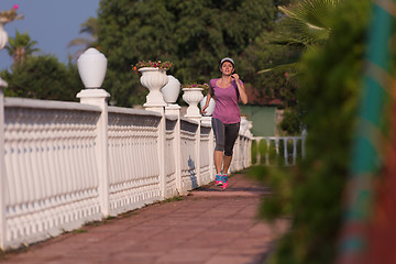 Image showing sporty woman jogging