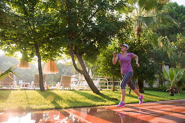 Image showing sporty woman jogging