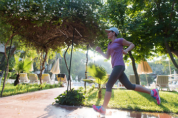 Image showing sporty woman jogging