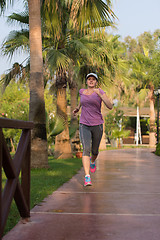 Image showing sporty woman jogging