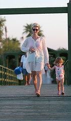 Image showing girl and mother walking