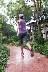 Image showing sporty woman jogging