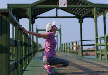 Image showing woman  stretching before morning jogging