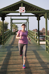 Image showing sporty woman jogging