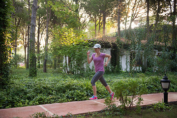 Image showing sporty woman jogging