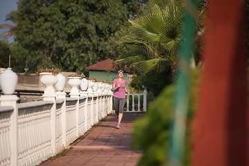 Image showing sporty woman jogging