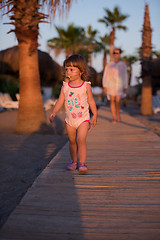 Image showing girl and mother walking