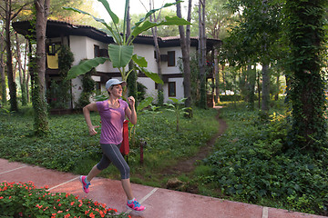 Image showing sporty woman jogging