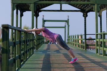 Image showing woman  stretching before morning jogging