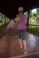 Image showing sporty woman jogging