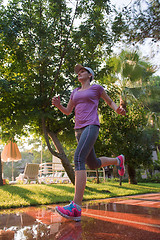 Image showing sporty woman jogging