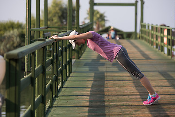 Image showing woman  stretching before morning jogging