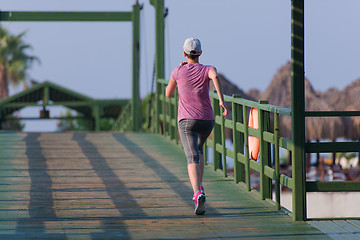 Image showing sporty woman jogging