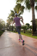 Image showing sporty woman jogging