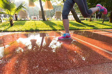 Image showing sporty woman jogging