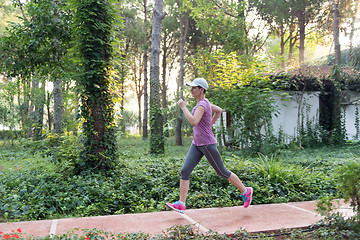 Image showing sporty woman jogging