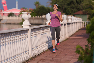 Image showing sporty woman jogging