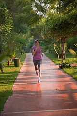 Image showing sporty woman jogging