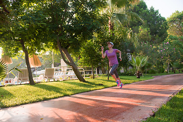 Image showing sporty woman jogging