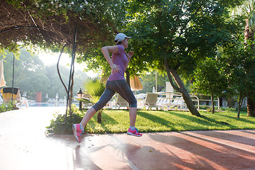 Image showing sporty woman jogging