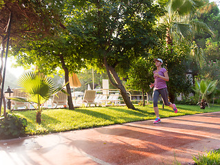 Image showing sporty woman jogging