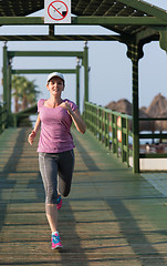 Image showing sporty woman jogging