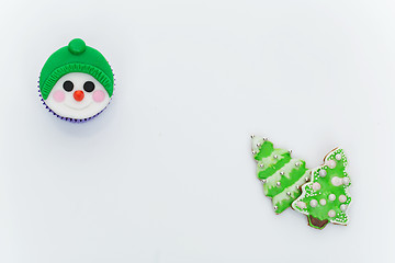 Image showing New Year cupcake and cookies