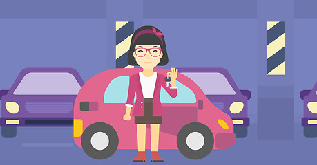 Image showing Woman holding keys to her new car.