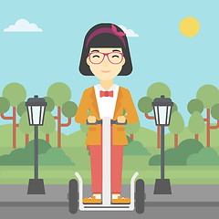 Image showing Woman driving electric scooter.