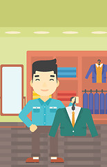 Image showing Man holding suit jacket in clothing store.