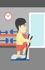 Image showing Man exercising on elliptical trainer.