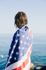 Image showing Back view of wet-haired woman in american flag