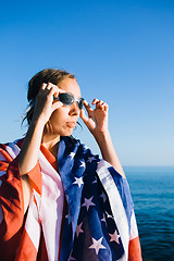 Image showing Young woman wearing swimming goggles in sunlight