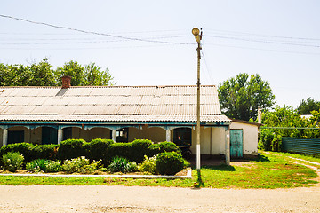 Image showing Rural house with tiled roof and garden