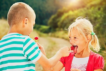 Image showing Children with lollipops